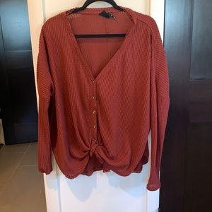 Urban outfitters thermal top. Rust colored. Slightly worn. Knots on the bottom.